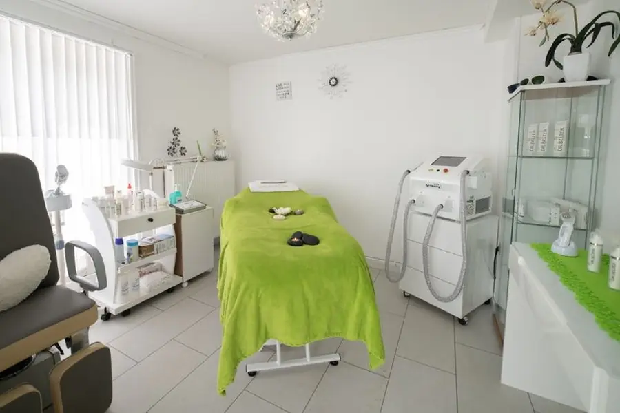 A bright, minimalist clinic treatment room