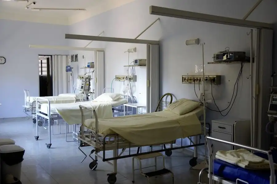 Spacious private hospital recovery room with an adjustable bed